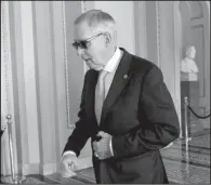  ?? AP/SUSAN WALSH ?? Senate Minority Leader Harry Reid walks back to his office after a meeting Friday with Senate Democrats on Capitol Hill in Washington.