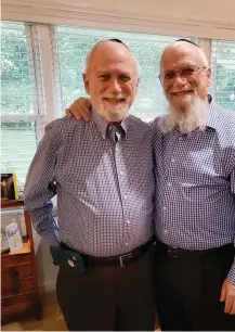  ?? (Courtesy David Levin) ?? DAVID LEVIN (right) with twin brother Jonathan, celebratin­g their 75th birthday in Atlanta recently. Were grits on the menu?