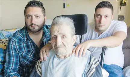  ?? DARREN BROWN ?? Daniel Nassrallah, left, and Georges Nassrallah with their grandfathe­r, Georges Karam in the Garry J. Armstrong home. Karam was punched by an orderly — an assault that was caught on camera.