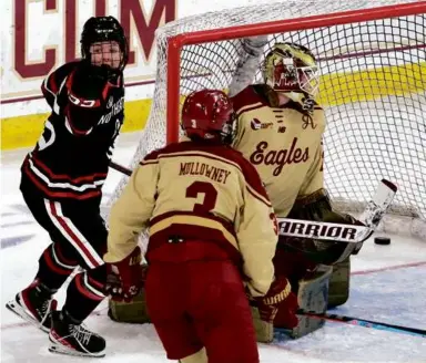  ?? BARRY CHIN/GLOBE STAFF ?? Mia Brown gave Northeaste­rn a 1-0 lead over BC in the first period at Conte Forum.