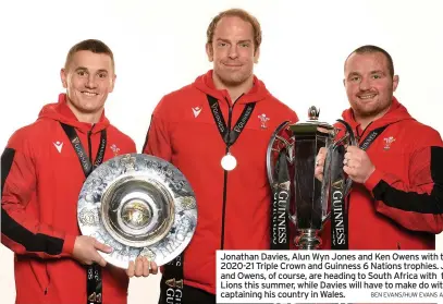  ?? BEN EVANS/HUW EVANS AGENCY ?? Jonathan Davies, Alun Wyn Jones and Ken Owens with the 2020-21 Triple Crown and Guinness 6 Nations trophies. Jones and Owens, of course, are heading to South Africa with the Lions this summer, while Davies will have to make do with captaining his country in Wales.