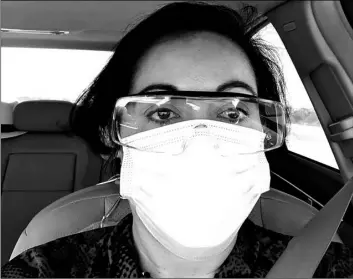  ?? Margarita Silva via AP ?? This March 23 photo provided by Margarita Silva shows her outside the La Palma Detention Center in Eloy, Ariz., wearing her husband’s land surveyor goggles, a mask she borrowed from a friend and medical gloves she got from a hardware store.