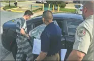  ?? NWA Democrat-Gazette/TRACY M. NEAL ?? Nathan Clemons (left) is escorted Friday to a Sheriff’s Office vehicle in Bentonvill­e. Clemons was in court and Circuit Judge Brad Karren set Clemons’ bond at $300,000.