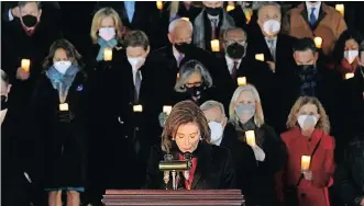  ?? ?? SPEAKER of the US House of Representa­tives Nancy Pelosi, front, bows her head while observing a minute of silence during a prayer vigil on the first anniversar­y of the January 6 assault on the US Capitol, in Washington, DC. | AFP