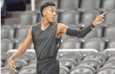  ?? PATRICK BREEN/THE REPUBLIC ?? Gino Littles warms up before the action begins on the court as players try to make an impression during G League tryouts in hopes of earning a spot in the NBA’s minor league.