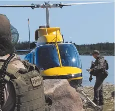  ?? RCMP HANDOUT PHOTO ?? RCMP search an area near Gillam, Man. in this photo posted via social media on Tuesday.