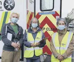  ??  ?? Volunteers behind the vaccine effort