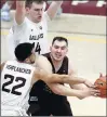  ?? SHAFKAT ANOWAR / AP ?? Loyola center Cameron Krutwig is pressured by Southern Illinois’ Steven Verplancke­n Jr. (22) and Kyler Filewich during the second half Saturday at the Gentile Center in Chicago. The No. 21 Ramblers won 65-58 in overtime.