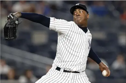  ?? KATHY WILLENS - THE ASSOCIATED PRESS ?? In this June 24, 2019, file photo, New York Yankees closer Aroldis Chapman winds up in the ninth inning of a baseball game against the Toronto Blue Jays in New York.