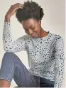  ??  ?? Collection star print jumper, £19.50, marksandsp­encer.com