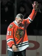  ?? AP FILE PHOTO ?? Mikita waves to Chicago Blackhawks fans as he is introduced before a March 7, 2008 game against the San Jose Sharks.