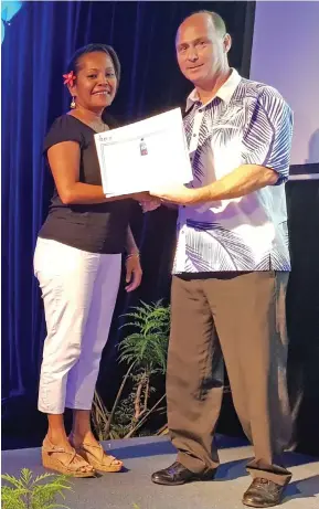  ?? Photo: FIJI Water ?? One of FIJI Water Long Service Award recipient, May Tokito with FIJI Water’s Yaqara Plant senior director Operations Patrick O’Brien.