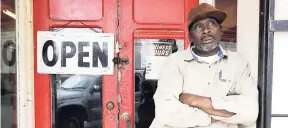  ??  ?? Businessma­n Homer King stands outside his small store in Marion, Ala. King, who lives in the old plantation region called the ‘Black Belt’, says he is praying for President Donald Trump despite misgivings about his election.