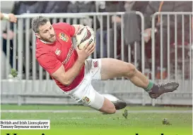  ??  ?? British and Irish Lions player Tommy Seymour scores a try