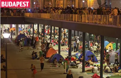  ??  ?? Setting up camp: Hundreds gather in a transit zone below Keleti station in the city centre
BUDAPEST