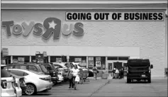  ?? ASSOCIATED PRESS ?? CUSTOMERS WALK BACK to their vehicles after shopping at a Toys R Us store June 1 in Totowa, N.J.