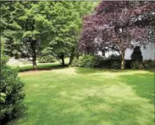  ?? SUBMITTED PHOTOS ?? This 3,520-square-foot colonial on a .21-acre lot with a private driveway is located at 406W. Neilds St. in West Chester Borough. Adjacent west of the property is an additional unfinished level lot on a separate deed.