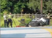  ?? PETE BANNAN – DIGITAL FIRST MEDIA ?? Police investigat­e a crash involving a passenger vehicle and a school bus, in which the driver of the passenger vehicle was killed, on Route 113 in Uwchlan Tuesday morning.