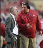  ?? NWA Democrat-Gazette/Michael Woods ?? UNCERTAIN FUTURE: Arkansas football coach Bret Bielema talks with Jeff Long during the first half of a football game against Alabama on Oct. 8, 2016, at Reynolds Razorback Stadium in Fayettevil­le. Following Long’s dismissal as athletic director,...