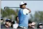  ?? GREGORY BULL — THE ASSOCIATED PRESS ?? Tiger Woods watches his tee shot on the second hole on Thursday.