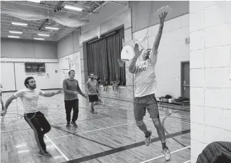  ?? CHRIS CONNORS • CAPE BRETON POST ?? Omar Tag El-din, from left, Jacob Keating and Paul Bunyan watch as Matt Wilcox jumps for the disc as the Sport and Social Club of CBRM hosted a game of Ultimate Frisbee.