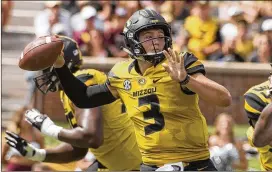  ?? L.G. PATTERSON / AP ?? Missouri quarterbac­k Drew Lock set school passing records with his 521-yard, seven-touchdown performanc­e in a 72-43 rout of Missouri State.