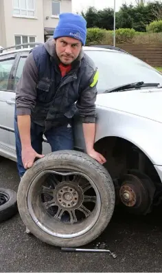  ??  ?? Kevin Sludds with the dented alloy of his BMW estate.