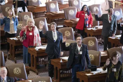  ?? Photograph: Bob Daemmrich/ZUMA Wire/REX/Shuttersto­ck ?? Texas presidenti­al electors take the oath of office to cast ballots on Monday.