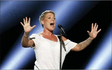  ?? ASSOCIATED PRESS FILE PHOTOS ?? Pink performs “Wild Hearts Can’t Be Broken” at the 60th annual Grammy Awards at Madison Square Garden in New York. The spreading coronaviru­s might have canceled several touring performanc­es from A-list musical artists, but those acts have found a new venue to sing: their living rooms. Pink, John Legend, Bono, Coldplay’s Chris Martin, John Mayer, Keith Urban and others have held virtual concerts from their homes as the world continues to practice social distancing to slow the spread of the virus.