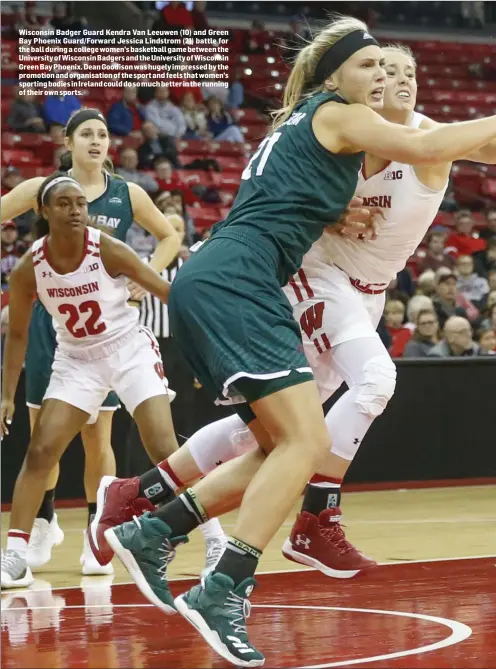  ??  ?? Wisconsin Badger Guard Kendra Van Leeuwen (10) and Green Bay Phoenix Guard/Forward Jessica Lindstrom (21) battle for the ball during a college women’s basketball game between the University of Wisconsin Badgers and the University of Wisconsin Green Bay...