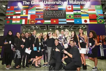  ??  ?? Lim (middle, wearing sunglasses) posing with the university’s internatio­nal student ambassador­s during the Star Education Fair 2017.
