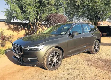  ??  ?? The Volvo XC60, left, is easily one of the best-looking models in its segment. Below: The ergonomica­lly designed gear lever doubles as a wrist/hand rest.