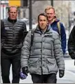  ?? Craig Ruttle / Associated Press ?? Major League Baseball deputy commission­er Dan Halem, center, arrives for a meeting in New York on Monday.