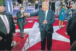  ?? Evan Vucci Associated Press ?? PRESIDENT TRUMP talks with voters Thursday after NBC’s town hall in Miami. His frustratio­n at the state of the race is starting to show in public.