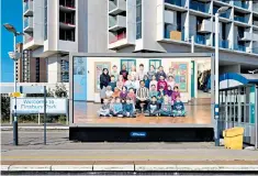  ??  ?? Child’s play: a ‘Year 3’ photograph on a billboard at Finsbury Park tube station