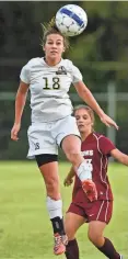  ?? ?? Oct. 26, 2013: Arlington freshman Kylee Bright, left, heads the ball during a 1-0 loss to Colliervil­le.