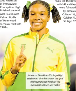  ?? ?? Jade-Ann Dawkins of St Jago High celebrates after her win in the girls’ triple jump open finals at the National Stadium last night.