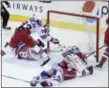  ?? NICK WASS - THE ASSOCIATED PRESS ?? Washington Capitals center Evgeny Kuznetsov (92), of Russia, scores the game-winning goal during overtime of an NHL hockey game against New York Rangers center Mika Zibanejad (93), defenseman Brady Skjei (76), and goaltender Henrik Lundqvist, second from right, , of Sweden, Sunday, Feb. 24, 2019, in Washington. Also seen is Capitals left wing Alex Ovechkin (8), , of Russia. The Capitals won 6-5in overtime.