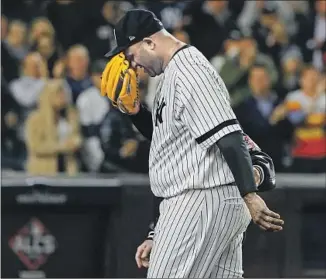  ?? Matt Slocum Associated Press ?? CC SABATHIA is helped off the field after partially dislocatin­g his left shoulder joint throwing a pitch in the eighth inning Thursday. He finishes his career with 251 wins and 3,093 strikeouts.