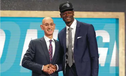  ?? Mike Stobe / Getty Images ?? Texas’ Mo Bamba, a 7-1 shot-blocker extraordin­aire, was taken sixth by the Orlando Magic in Thursday night’s NBA draft.