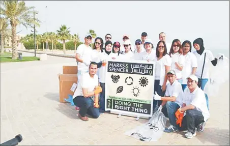  ??  ?? Marks & Spencer’s team during their beach clean-up campaign