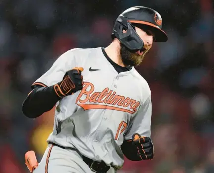  ?? ORIOLES CHARLES KRUPA/AP ?? Orioles rookie outfielder Colton Cowser pumps his fist while rounding the bases after hitting a solo home run in the fifth inning Thursday against the Red Sox in Boston. It was his first career homer, and he’s hit three more since.