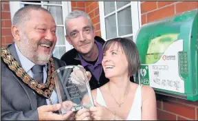  ??  ?? The Mayor, Cllr Ozzy O’Shea, presents the awards to Maria while looking on is Chris Boothby. Picture: Ted Cottrell