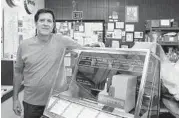  ??  ?? Patrick Kubricky owns A1 Jukebox, which has sold and shipped parts for antique jukeboxes for three decades.