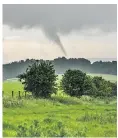  ??  ?? A twister over Melbury Hill, outside Shaftesbur­y, Dorset, this week