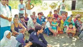  ?? HT PHOTO ?? Rescued bonded labourers in Muzaffarpu­r village of SBS Nagar on Monday.