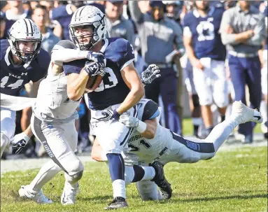  ?? Peter Hvizdak / Hearst Connecticu­t Media ?? Yale running back Zane Dudek runs for a long gain against Columbia. Dudek will become the first freshman ever to lead the Ivy League in rushing.