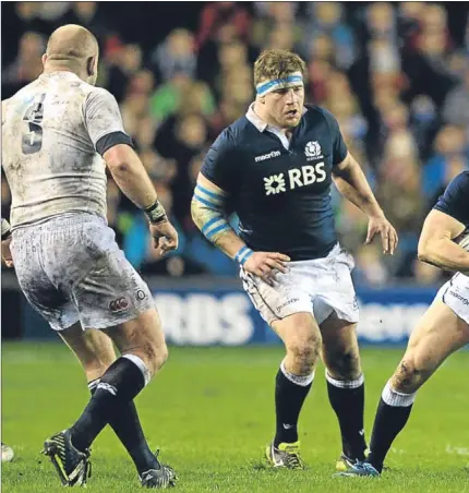  ?? Getty Images.
Picture: ?? Matt Scott evades a tackle from Courtney Lawes to set up a Scotland attack.