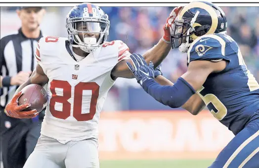  ?? Shuttersto­ck ?? CRUZ AWAY: Victor Cruz, holding off the Rams’ T.J. McDonald, and the Giants head into their bye at 4-3 and on a two-game winning streak, but still in last place in the NFC East. Cruz said he’s not concerned about the standings.