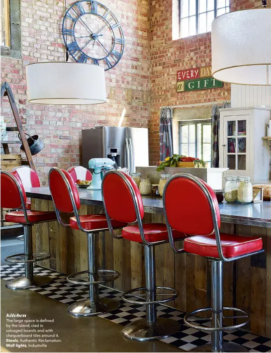  ??  ?? Kitchen
The large space is defined by the island, clad in salvaged boards and with chequerboa­rd tiles around it.
Stools, Authentic Reclamatio­n.
Wall lights, Industvill­e